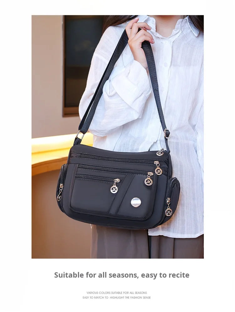 Bag Women's Large Capacity Shoulder Bag Waterproof and Wear Resistant Multi Pocket Commuter Leisure Outdoor Crossbody Bag